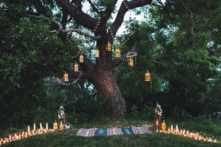 Night wedding ceremony with lot of candles and vintage lamps