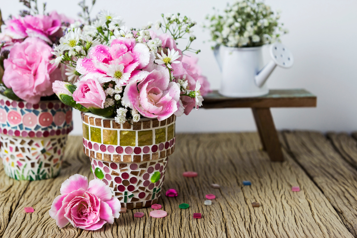 Pink carnation in mosaic flower pot