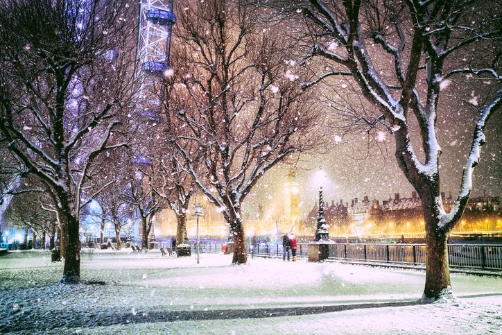 Snow covered Jubilee Gardens in London at dusk