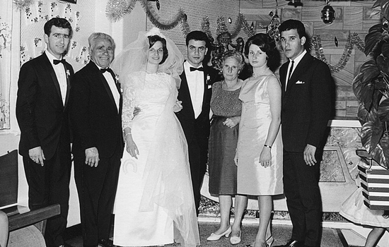 Filippo and Serina at their wedding seen with their families