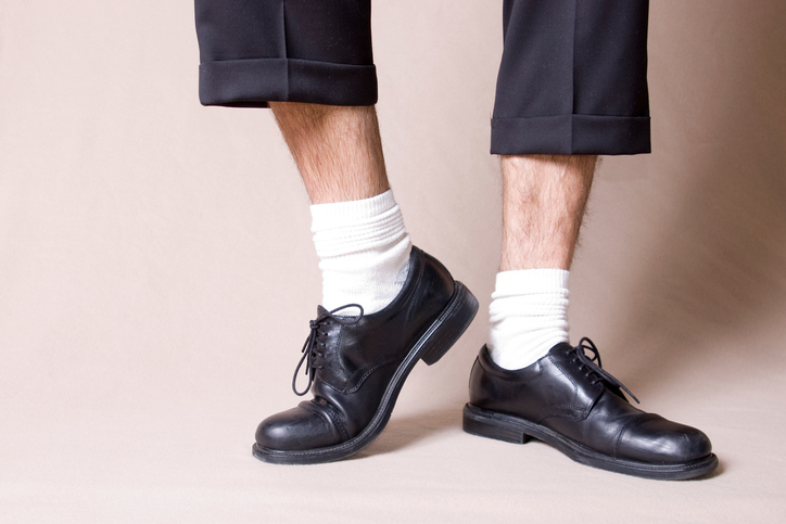 Black work shoes with white socks and ankles