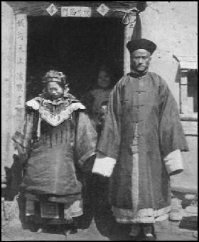 Newlyweds in China don traditional wedding garb during this wedding in the 1930s.