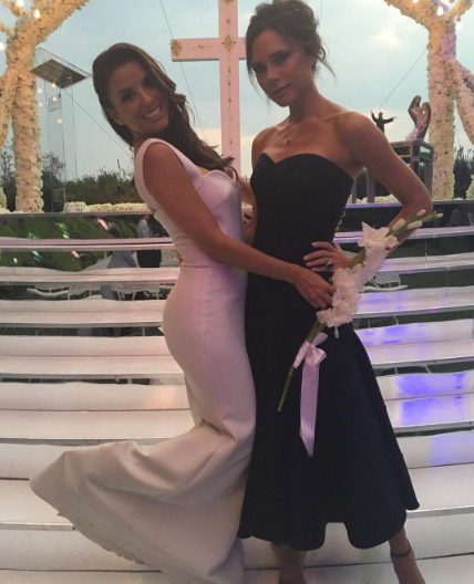 Eva Longoria poses for a photo with her bestie and wedding dress designer Victoria Beckham