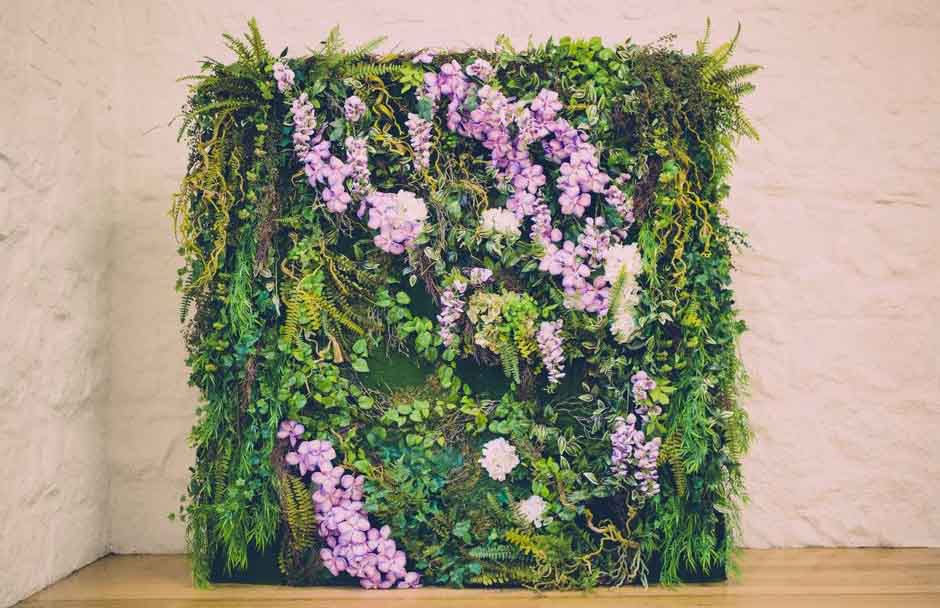 flower wall to put behind bridal table
