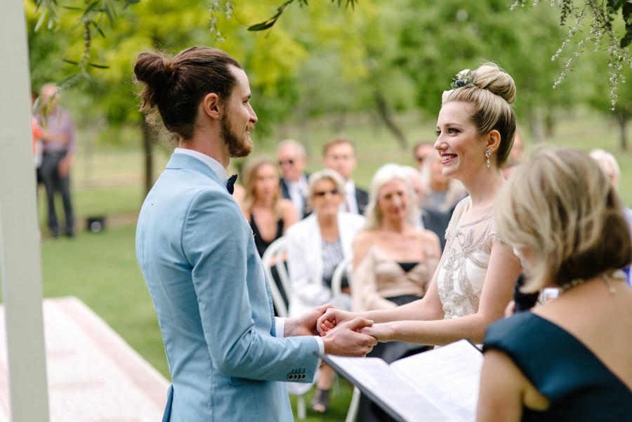 Wedding ceremony couple at altar reading