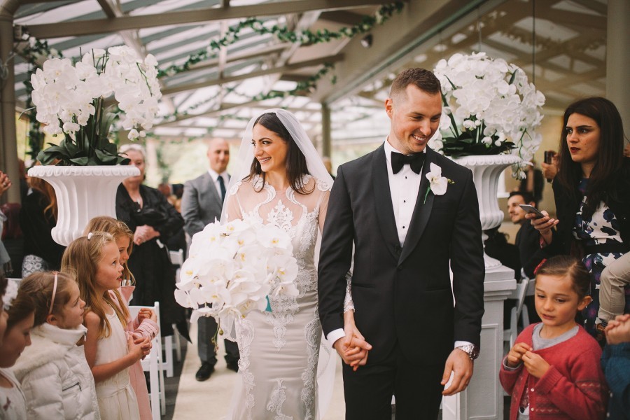 bride and groom exit their wedding ceremony