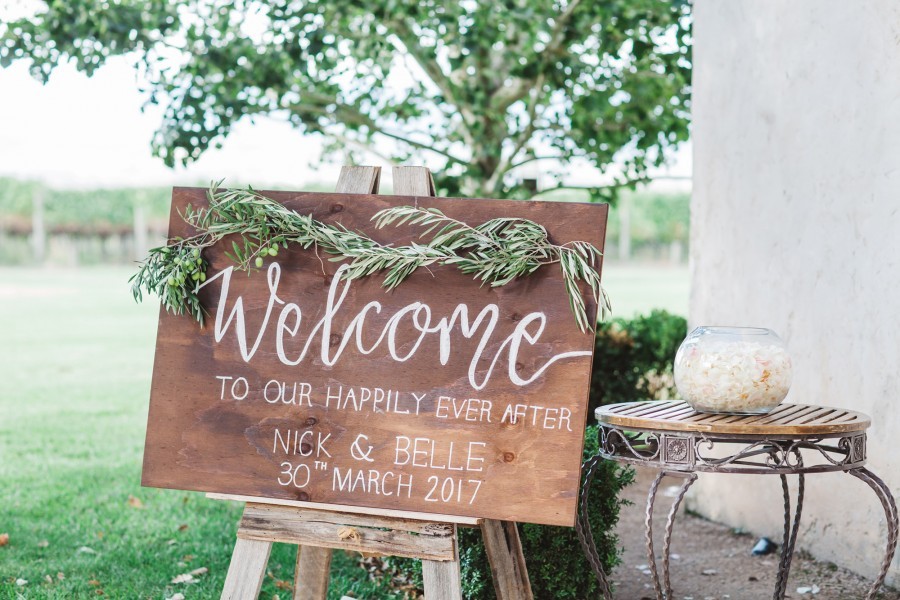 wedding sign that reads: "Welcome to our happily ever after" wedding sign ideas