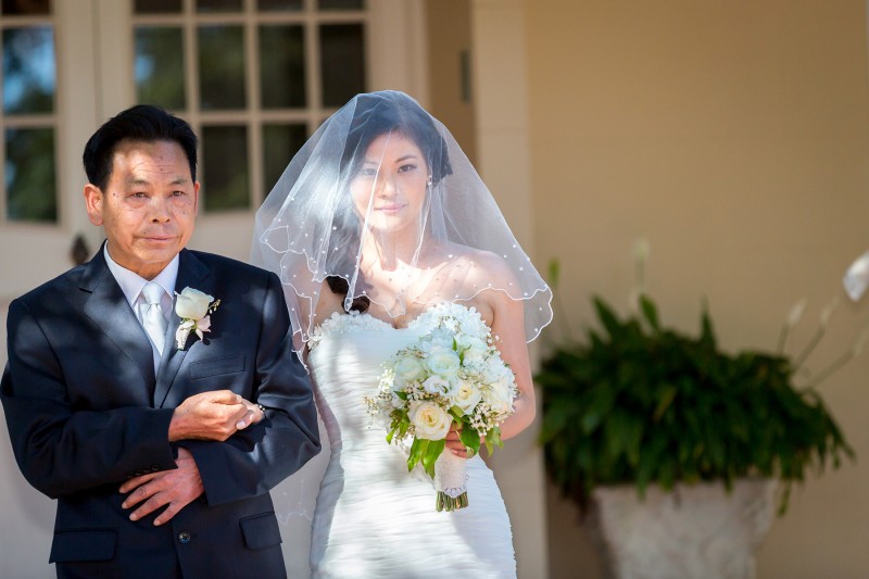 Bride and her father walk down the aisle