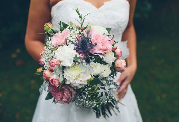 A bridal bouquet peppered whit white Chrysantheyms. Image