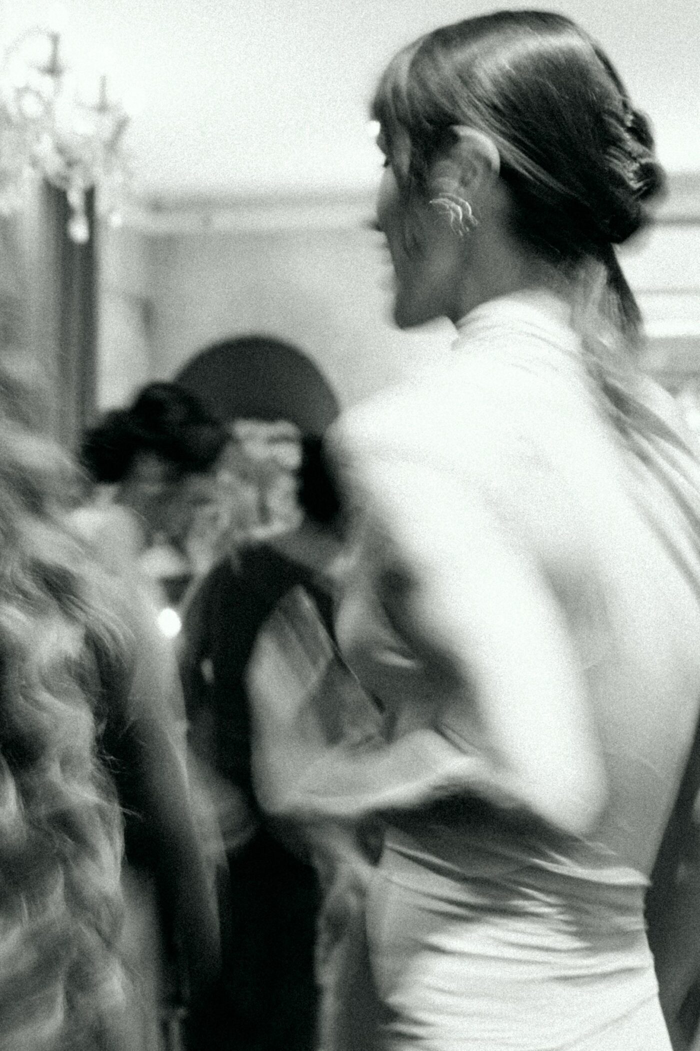 black and white photo of wedding guest from the back
