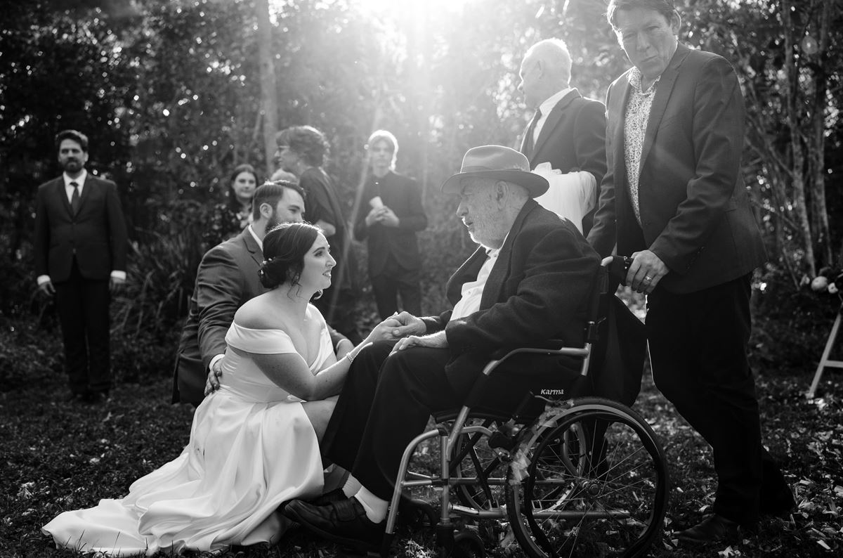 Black and white image of a man in a wheelchair