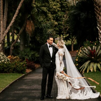 Top garden wedding venues in Sydney with bride and groom in lush gardens