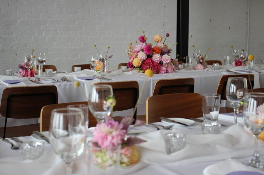 Seasonal wedding flowers adorn the tablescapes