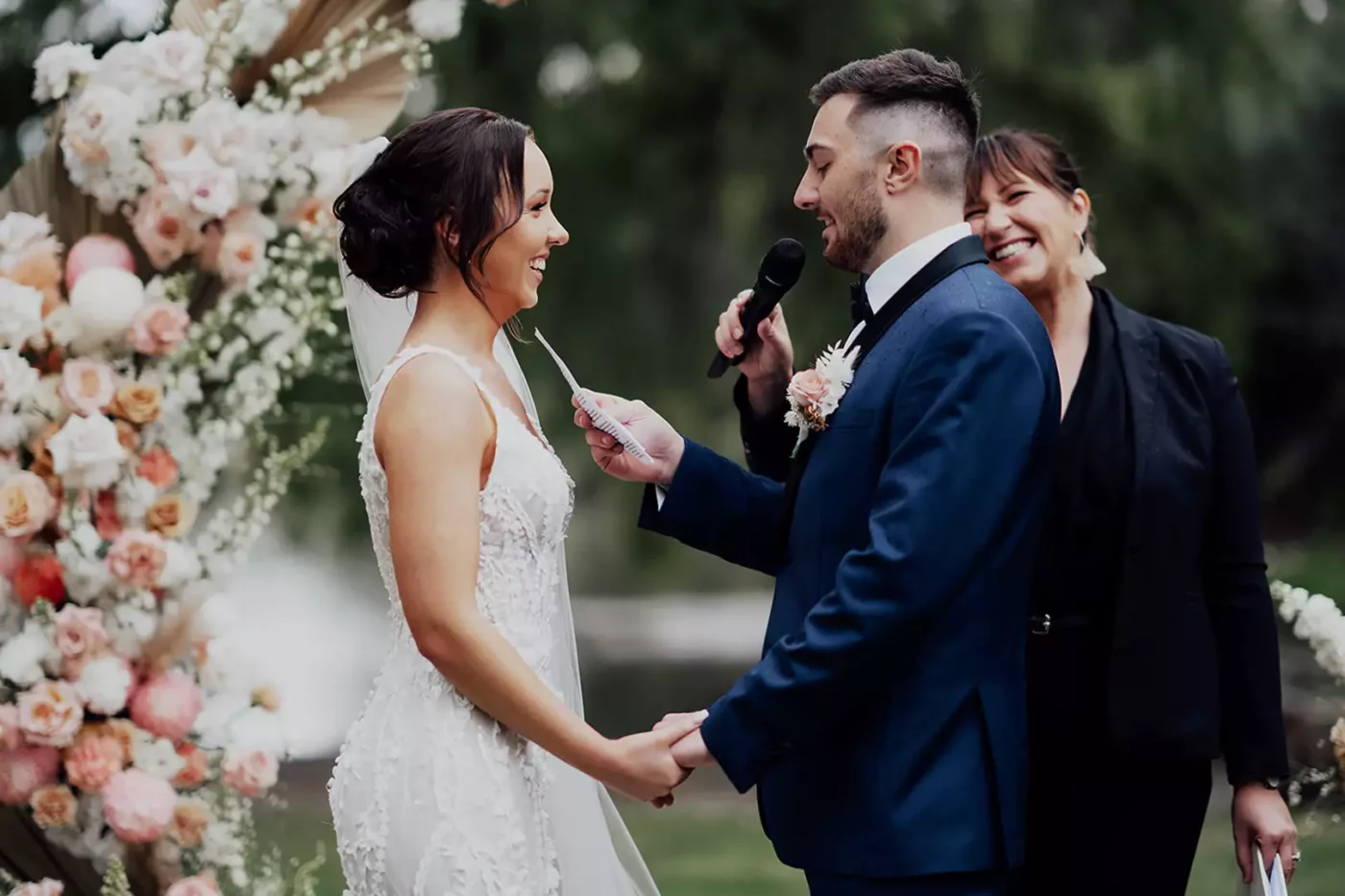 A couple share their vows with wedding vows for him