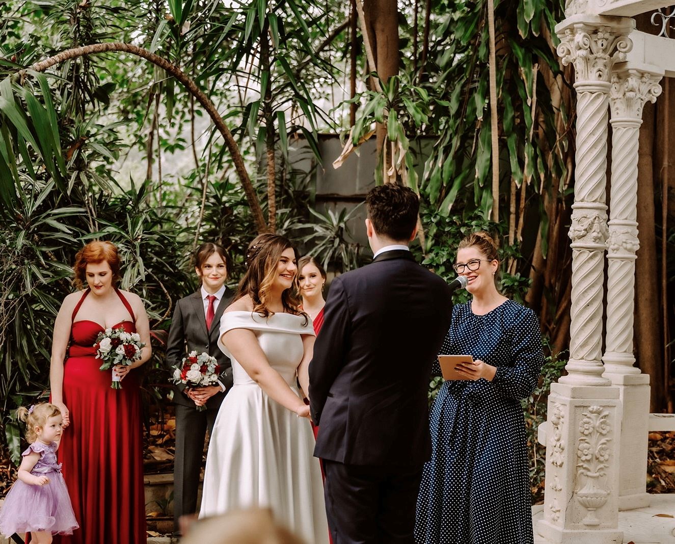 wedding with bright red bridesmaid dress