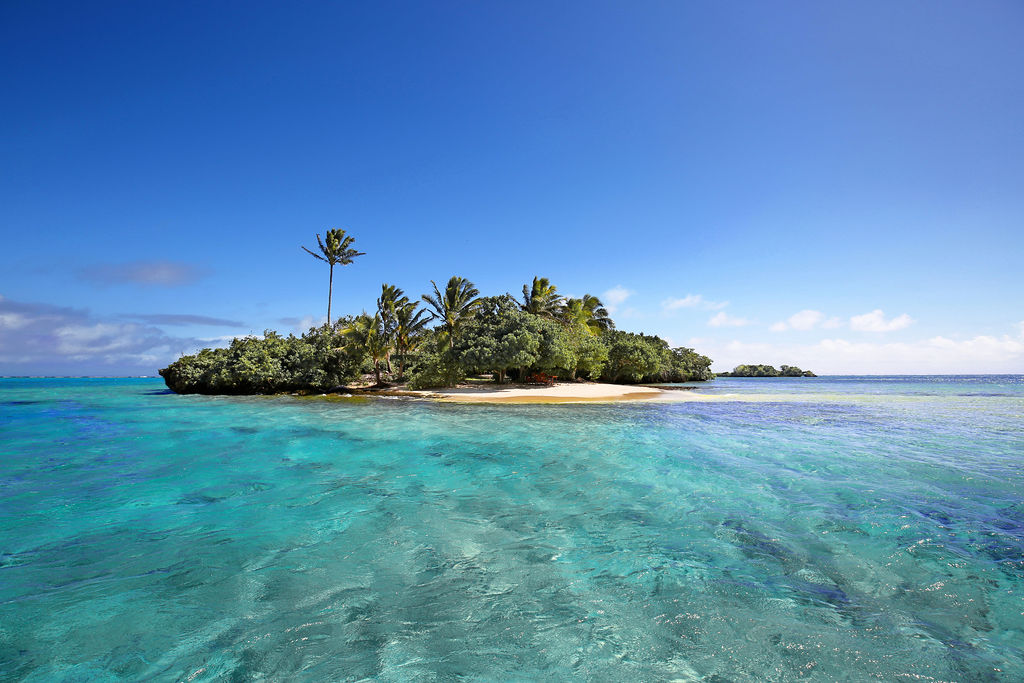 Fijian island with white sand and blue water