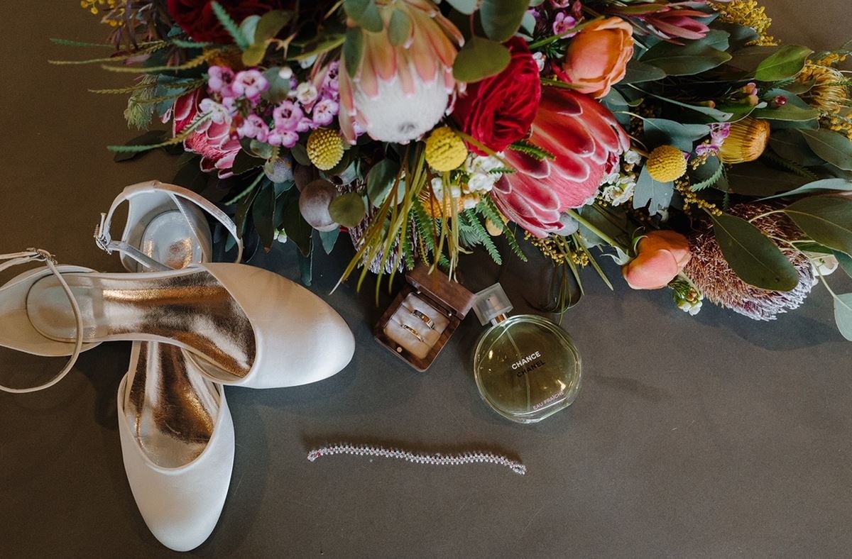 Wedding flowers with perfume, shoes and jewellery