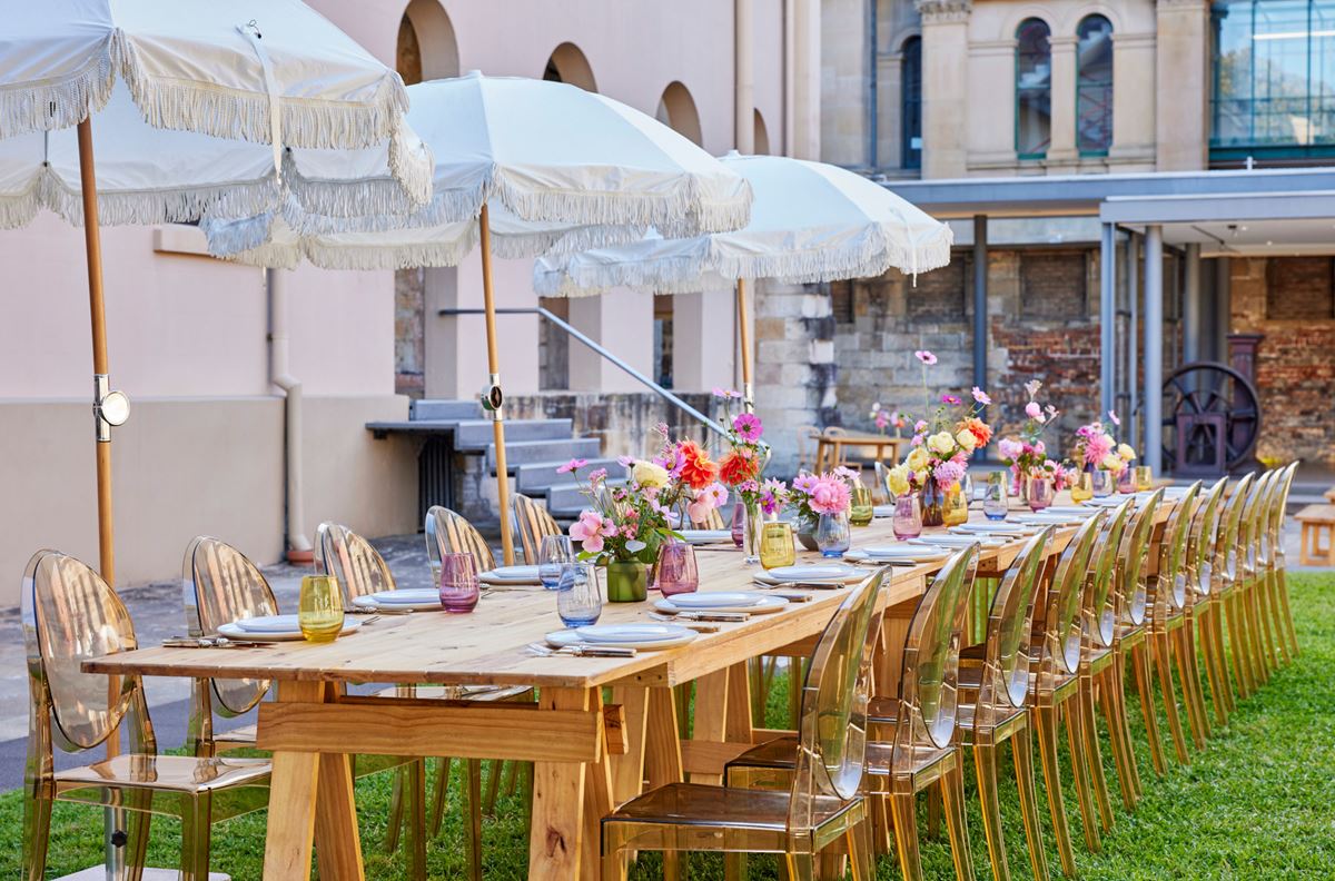 Wedding setting with colourful flowers on a long table