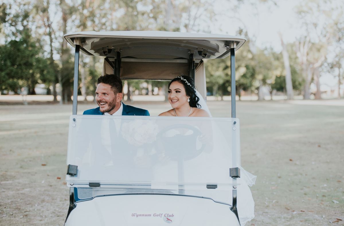 couple in a golf cart