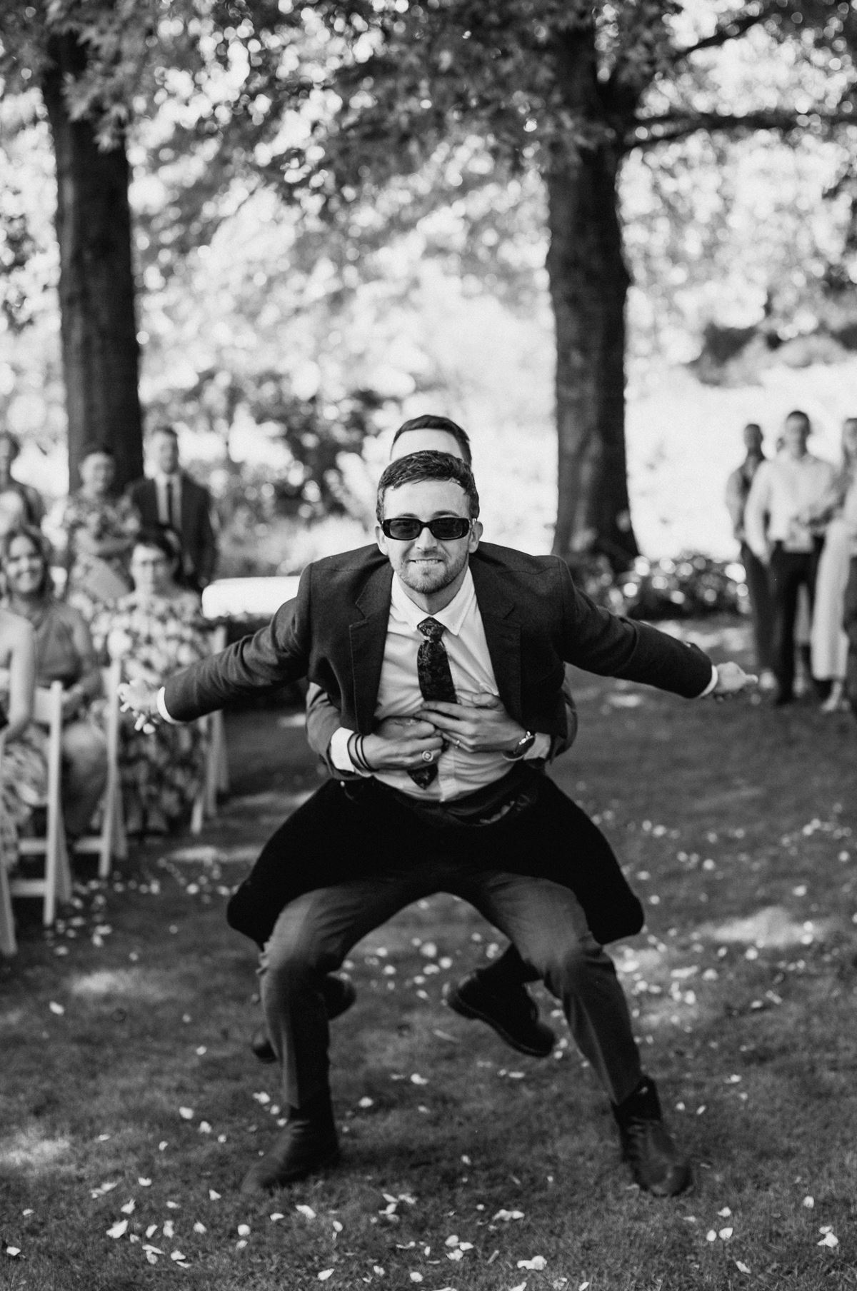 black and white frineds walk down the aisle wedding icks