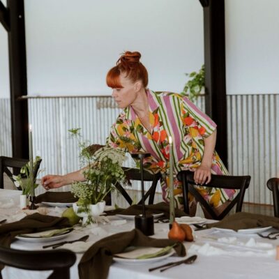 Advertise your wedding business wedding stylist setting up for boho wedding