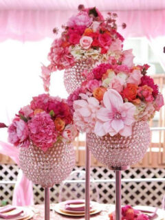 wedding flowers and crystal vases as a centerpiece at a wedding table