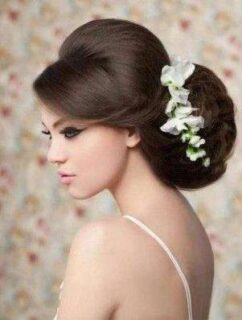Serious wedding hairstyle with flowers