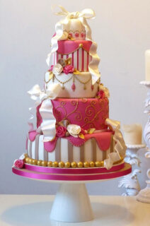 wedding cake in champagne and bright pink colors