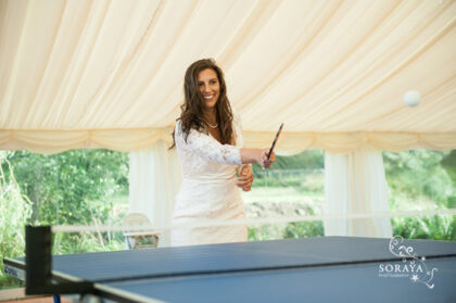 bride playing table tennis