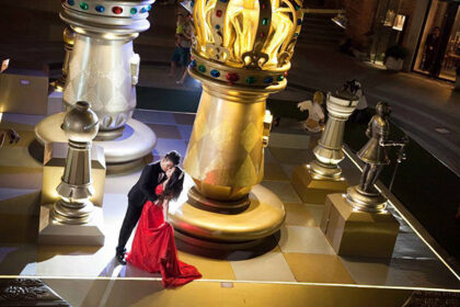 wedding-couple-amidst-giant-chess-pieces