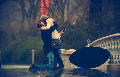 a couple kissing in the rain
