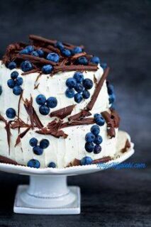 wedding cake with blueberries on top
