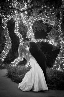 newlyweds dancing under trees