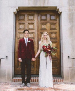 groom in red velvet jacket