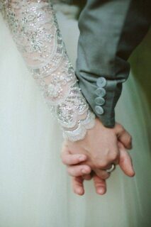 Newlyweds holding hands