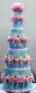 blue wedding cake with pink blooms