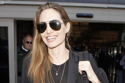 Angelina proudly sported a wedding band at a recent UN event in Congo. Image: Maciel/X17online.com|Angelina proudly sported a wedding band at a recent UN event in Congo. Image: Maciel/X17online.com|Angelina Jolie's engagement ring is thought to be worth a quarter of a million dollars|Angelina Jolie was recently spotted wearing a wedding band|The mystery of Angelina Jolie's new wedding ring has been solved|