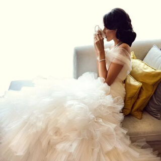 bride drinking coffee in her dress|