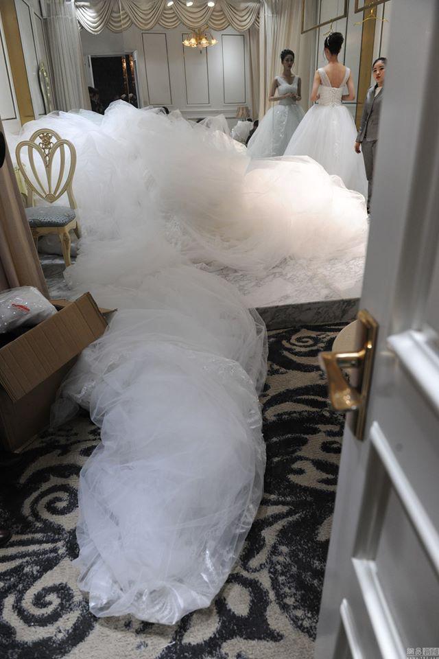 Designer showcases wedding gown – with a 100m-long train