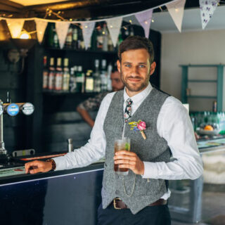 Prosecco and Pimms Butcher's Bike|Box Tree Events|Guests toasting with champagne at wedding reception|Stacey and Tom's Country Wedding||Jo and Rob's Modern Craft Wedding|