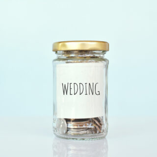 Woman Using Laptop|wedding budget|Young couple planning wedding|Wedding budget mindmap|Wedding Coin Jar|wedding budget|